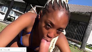 Ebony teen sucking big white dick outdoors