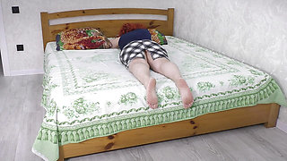 The stepmom deliberately lay down on the bed so that her stepson would have sex with her
