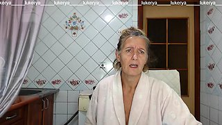 Hot mistress Lukerya in the kitchen in a bathrobe