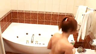 Redhead chesty amateur babe Atlantida gets ready for bath