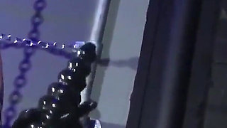 Lady Valeska and Miss Patricia have their sub over a bench.