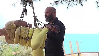 Public whore suspension bondage exposed with buttplug in ass