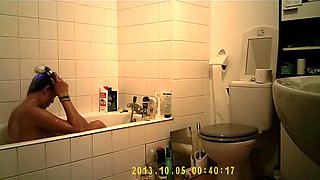 Brunette uses the toilet and takes a shower