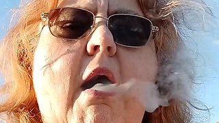 Bearded Lady try's to  lights  on windy beach!