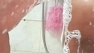 Big-breasted Turkish MILF taking a bath.
