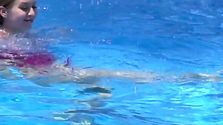 Lesbian Girls Are Having Fun in a Pool with an Inflatable Shark