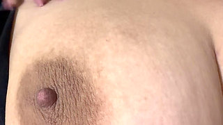 Sexy blonde massages her huge tits very delicious