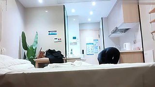 Cute amateur asian web cam girl playing with her toy