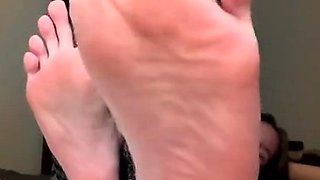 Sexy leggy brunette enjoys foot fetish