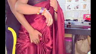 Indian aunt Kavitha catches hot moment with her beau while talking to her hubby in the kitchen, then intense hardcore action
