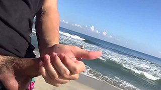 Two horny sluts sucking cock on the beach under the sound of the sea breeze