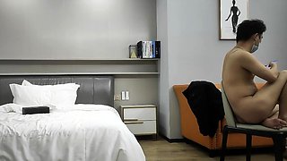 Cute amateur asian web cam girl playing with her toy