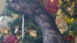 Playing with a christmas three with my legs in stockings