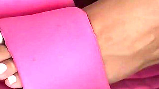 Tanned Feet in Pink Flip-flops