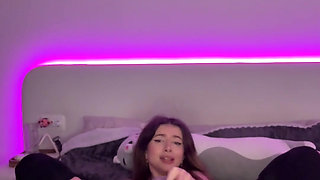 Adrianna Savu, a cosplaying school-girl, wears stockings and heels without panties, and carries a ginormous faux-cock